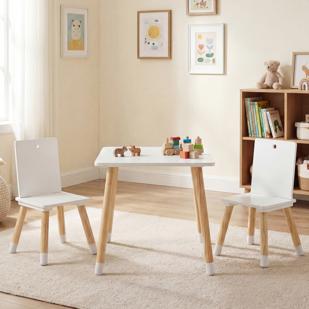 Kids wooden table and 2 chairs set in white, made of pine wood and MDF, perfect for playtime in a nursery or playroom.