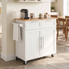 White kitchen island cart with rubber wood top, drawers, towel rack and swivel casters in a front angled view.