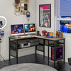 L-shaped computer desk in gray with charging station, adjustable shelf, and sturdy metal frame for home office use.