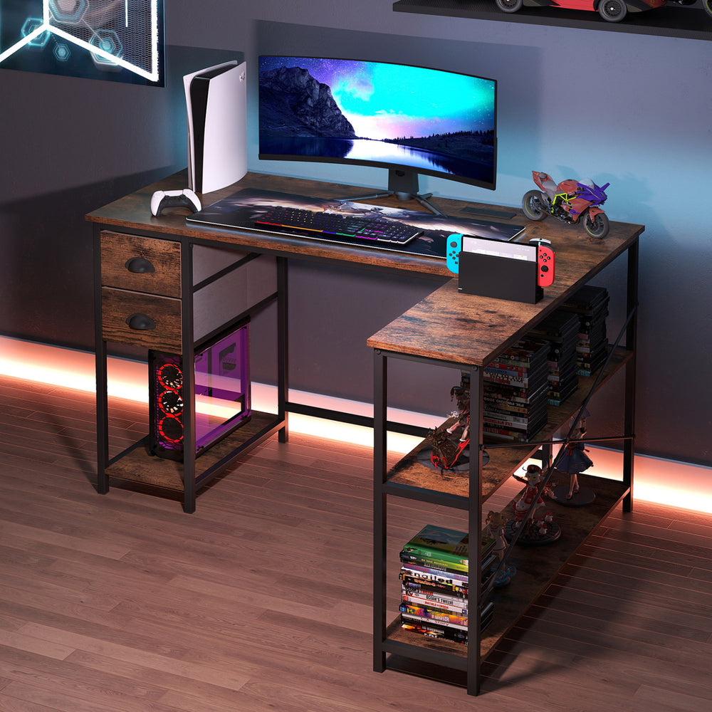 L-shaped rustic brown desk with charging station, open shelves, and two fabric drawers for versatile workspace use.
