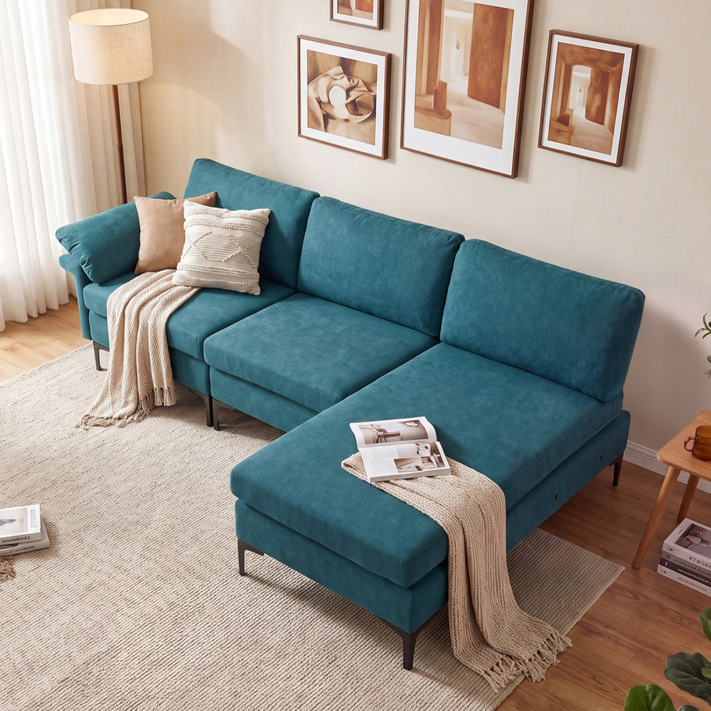 L-shaped sectional sofa in turquoise with chaise, featuring USB ports, hidden storage, and comfortable pillow armrests.