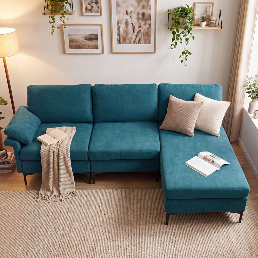 Turquoise L-shaped sectional sofa with chaise offers cozy pillow armrests and ample storage for a clutter-free living space.