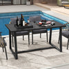 Large black dining table with heavy-duty metal frame, ideal for 4-6 people, placed by a poolside for outdoor dining.