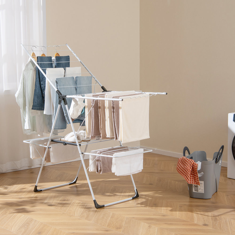 2-level laundry drying rack with height adjustable wings, sturdy metal tubes, and practical sock clips for indoor use.