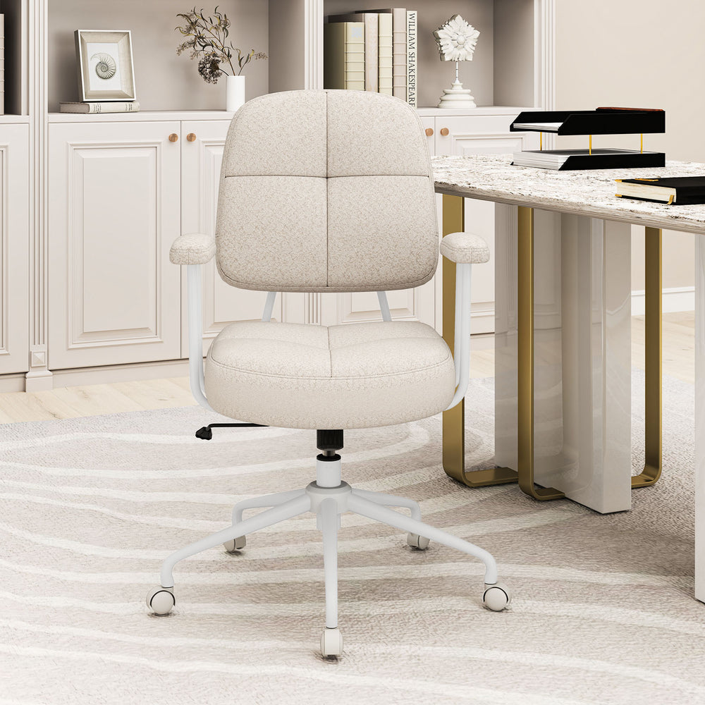 Side view of the Leathaire upholstered task chair in beige, showcasing its elegant design and cushioned back for office.