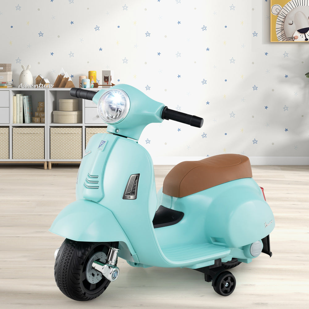 Kids ride-on motorcycle in green with LED headlight, horn sound, and training wheels for safe playtime indoors.