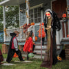 Life-size animatronic witch with red eyes and posable arms, perfect for Halloween decorations and scaring.