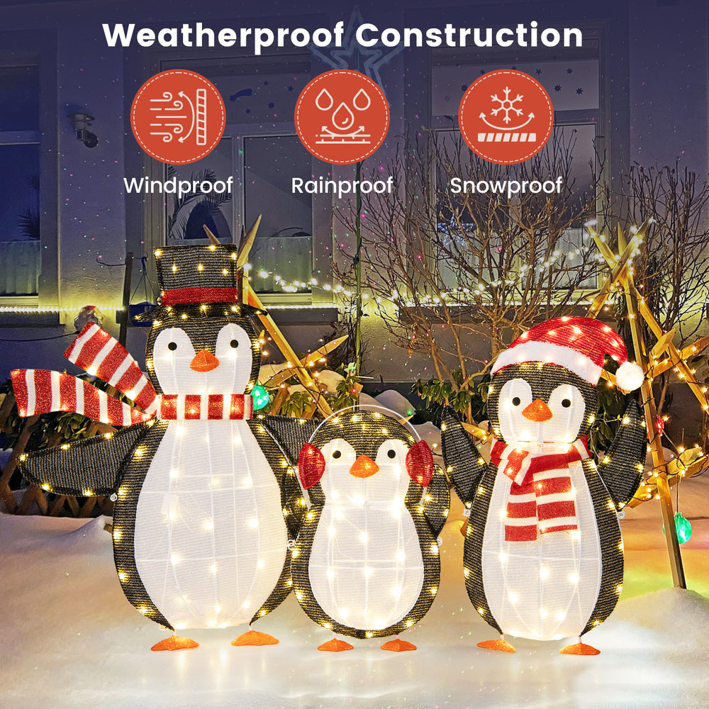 Three light-up penguins Christmas decorations with 194 LED lights, featuring a weatherproof design for outdoor use.