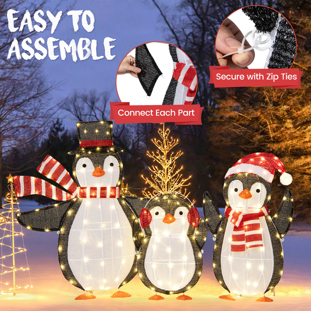 Three light-up penguins Christmas decorations with 194 LED lights, easy assembly, and durable design for outdoor use.