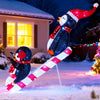 3D lighted Christmas decoration featuring penguins on a candy cane slide with 170 LED lights for festive outdoor.