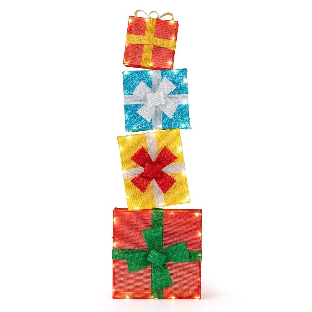 Stacked lighted gift boxes in red, blue, yellow, and white with decorative bows, perfect for Christmas decoration.
