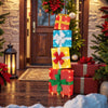Stacked lighted gift boxes with decorative bows and warm LED lights, perfect for Christmas outdoor decoration.