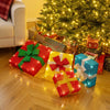 Colorful lighted gift boxes with decorative bows, pre-lit for Christmas, perfect for indoor and outdoor holiday.