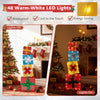 Stacked lighted gift boxes with warm LED lights, glittering fabric, and sturdy metal frame for festive indoor and.