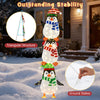 Close-up of lighted penguin decoration with warm white lights, showcasing colorful hats and stable triangular structure.