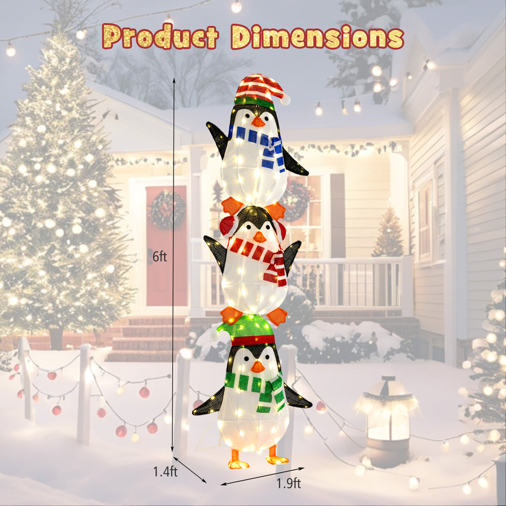 Three lighted penguins decoration with warm white lights and cute hats, measuring 6ft tall for festive outdoor display.