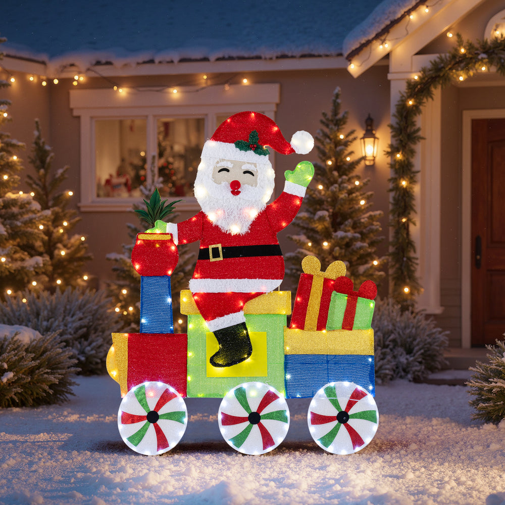 Lighted Santa on a train decoration with LED lights, featuring gift boxes and colorful wheels for festive outdoor.