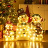Lighted snowman family decoration set featuring a dad, mom, and baby, adorned with 95 warm-white LED lights for festive.
