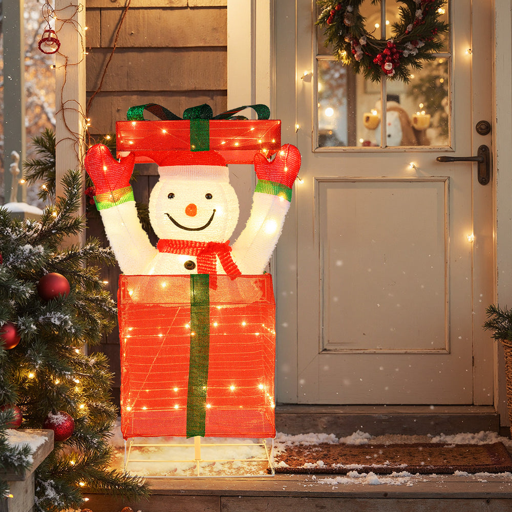 Lighted snowman in a gift box with red scarf, 100 warm LED lights, perfect for festive indoor and outdoor decoration.