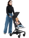 Lightweight airplane-ready stroller with all-terrain wheels, featuring a compact fold and adjustable canopy for optimal.