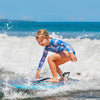 Lightweight boogie board with XPE deck and HDPE bottom, perfect for kids riding waves at the beach.