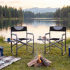 Lightweight folding camping chairs with side tables by a lake, featuring black 600D Oxford fabric and sturdy metal.