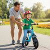 Toddler riding a lightweight blue balance bike with adjustable seat and anti-skid tires for outdoor fun.