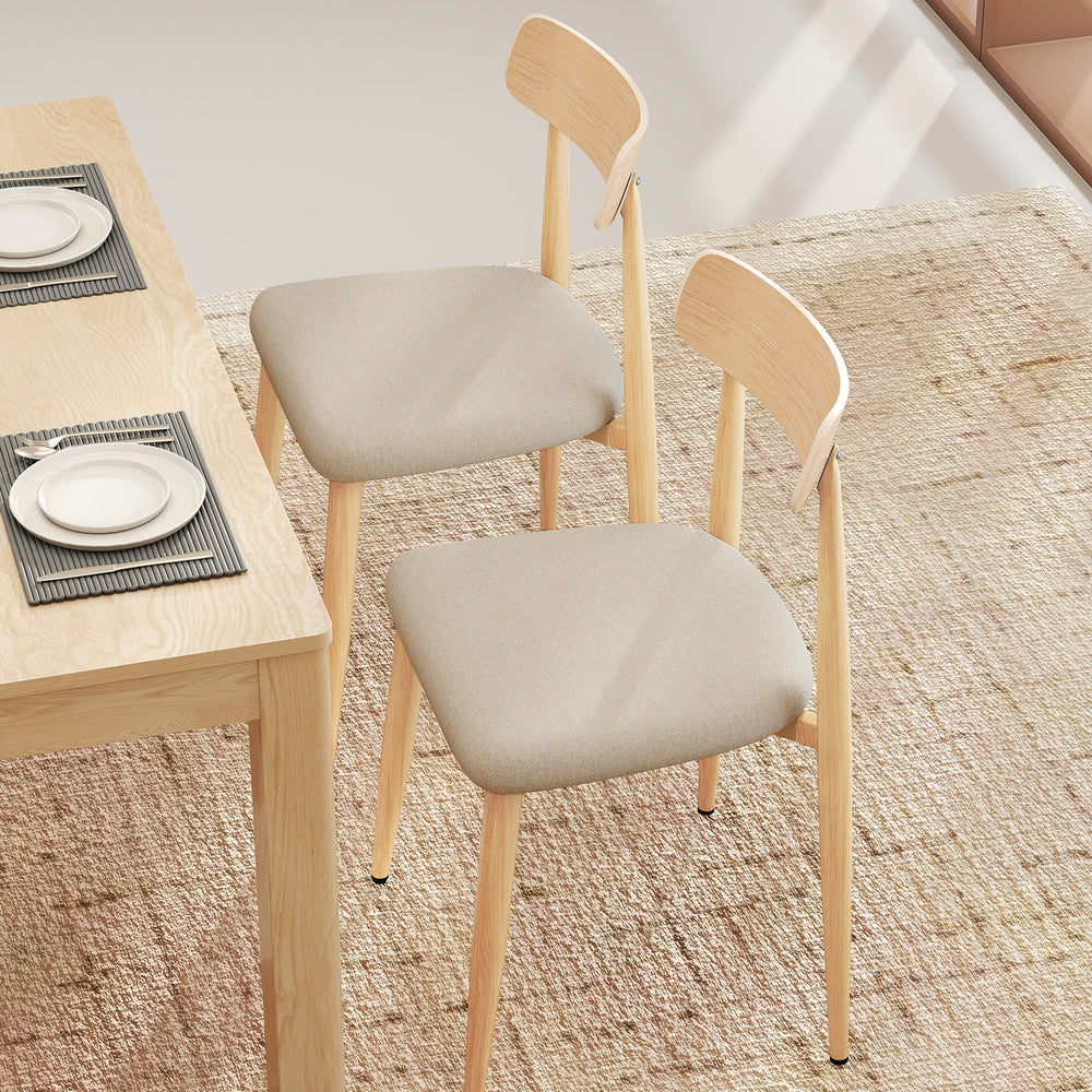 Set of 2 modern dining chairs with padded linen fabric seats and curved backs, featuring oak-like metal legs for.