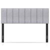 Gray linen upholstered headboard with vertical channel tufting and solid wood legs, adjustable for full or queen beds.