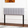 Gray linen upholstered headboard with vertical channel tufting and solid wood legs, adjustable for full or queen size.