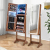 Side view of a lockable jewelry armoire in walnut, showcasing the interior storage for jewelry and makeup with LED.