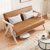 Brown loveseat sofa with throw pillows, rubber wood frame, and padded seat for small spaces, ideal for living rooms.