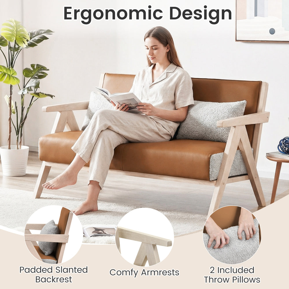 Loveseat sofa in brown with padded backrest and throw pillows, featuring a durable rubber wood frame for small spaces.