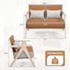 Loveseat sofa with a rubber wood frame and brown artificial leather, featuring throw pillows, ideal for small spaces.