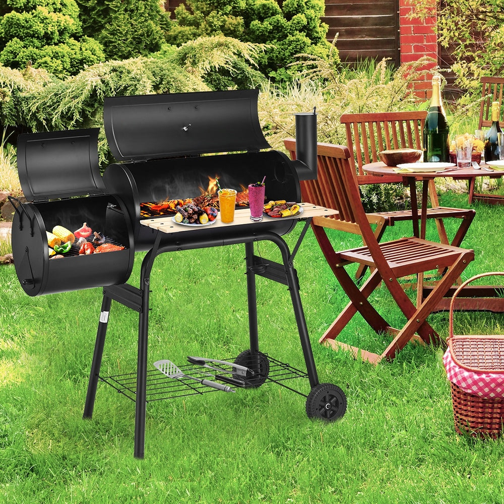 Low Smoke Outdoor BBQ Grill showcasing the attached firebox and side shelf, perfect for outdoor barbecues and.