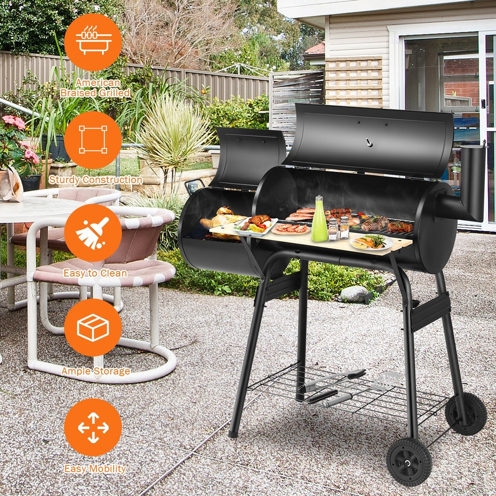 Low Smoke Outdoor BBQ Grill with steel firebox, sturdy construction, and side shelf for outdoor cooking convenience.