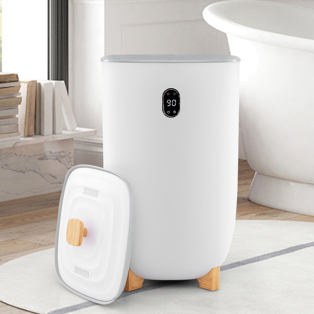 White 40L towel warmer bucket with LCD control panel, wooden legs, and dual fragrance disc holders for family use.