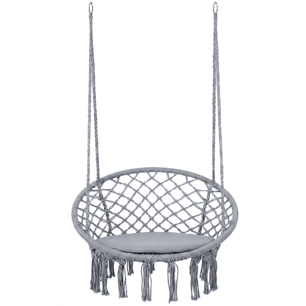 Macrame swing chair hammock in grey with round seat cushion and decorative fringes, ideal for indoor and outdoor use.