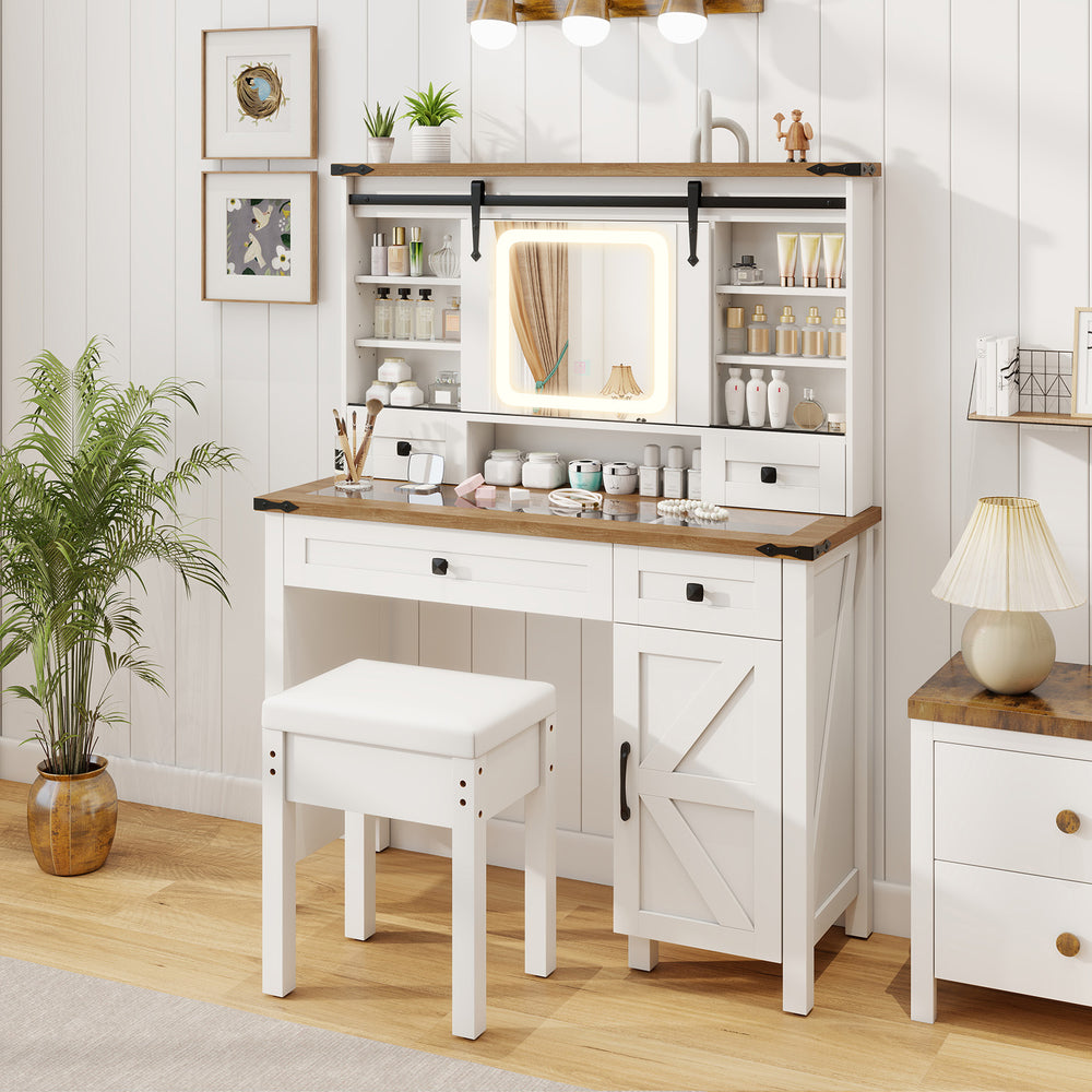 Makeup vanity desk in white with LED mirror, matching stool, and adjustable shelves, perfect for beauty routines.