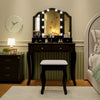 Makeup vanity table set in black with lighted tri-fold mirror, cushioned stool, and spacious storage for beauty.