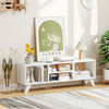 White media TV console table with raised support legs, featuring spacious top and open compartments for storage.