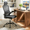 Ergonomic black mesh office chair with adaptive lumbar support and flip-up armrests, ideal for long hours of work.