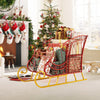 Elegant red metal Christmas Santa sleigh basket with gifts, featuring a sturdy golden base for holiday decoration and.