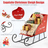 Metal Christmas sleigh basket with festive motifs, perfect for storing gifts and decorations in your holiday space.