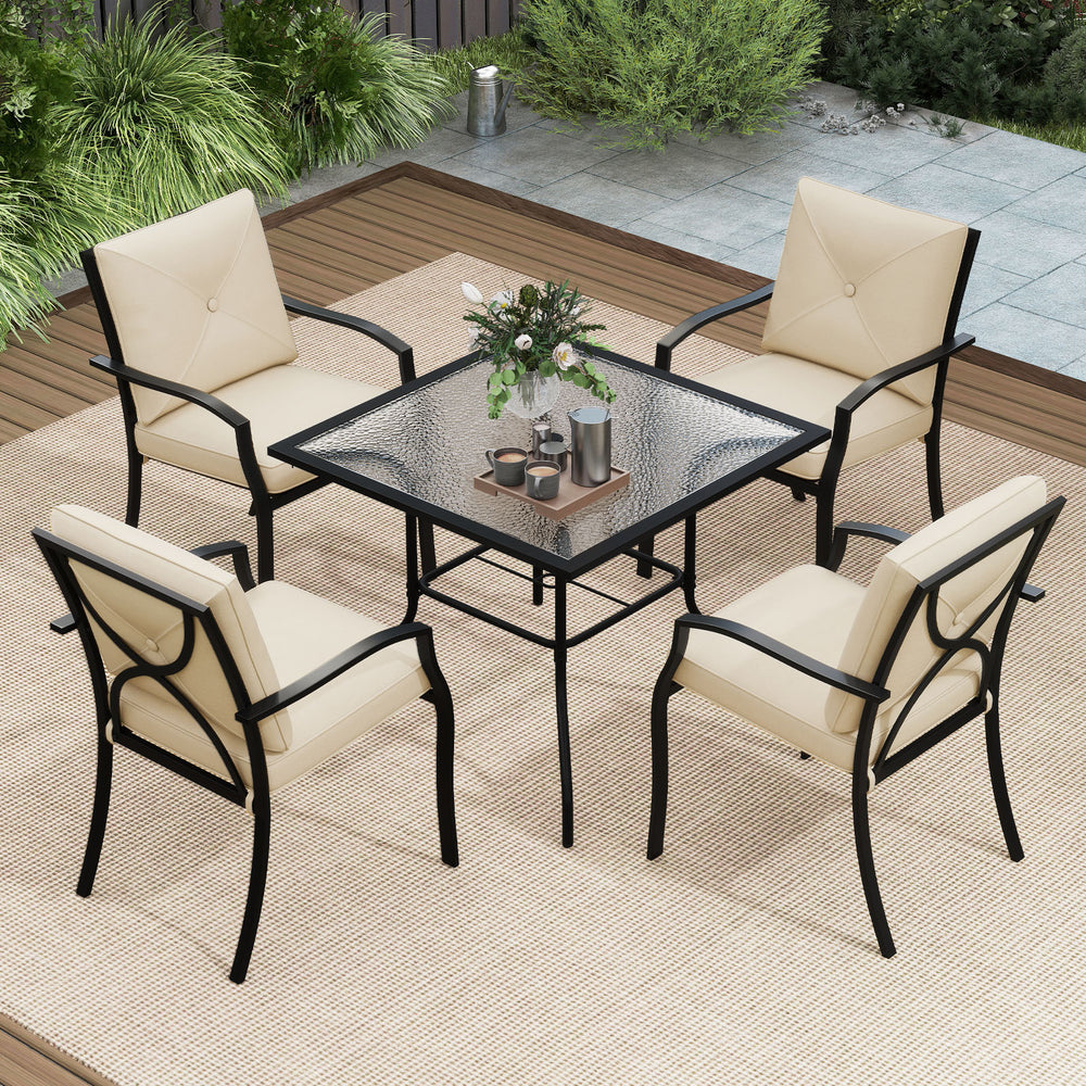 Stackable beige metal outdoor dining chair set with armrests, featuring large cushions for comfortable alfresco dining.