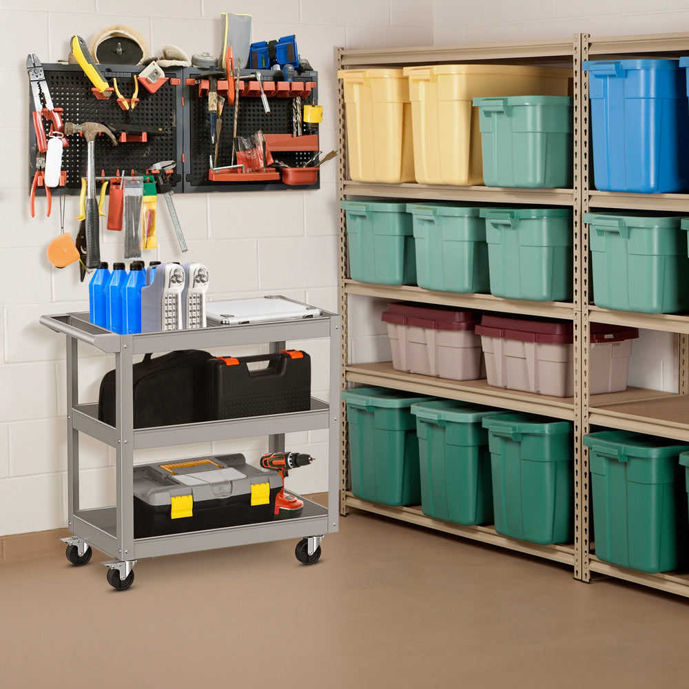3-tier gray metal utility cart with flat handle and lockable wheels, ideal for storing tools and supplies in various.