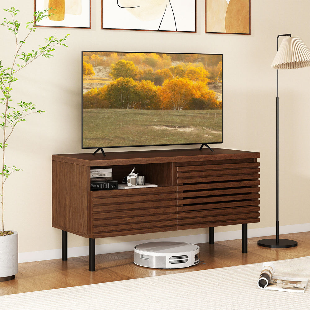 Mid Century fluted TV stand in walnut with open compartment, spacious drawer, and solid metal legs for modern interiors.