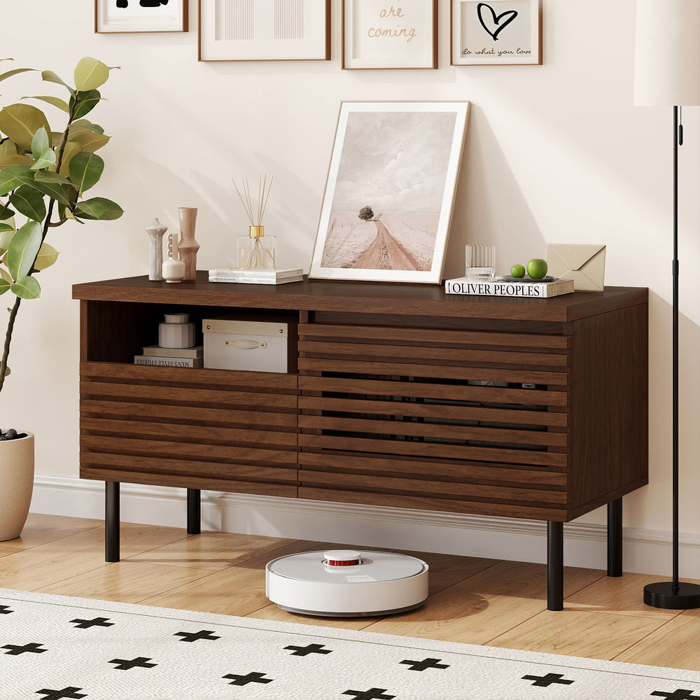 Mid Century fluted TV stand in walnut with open compartment and drawer, perfect for a modern entertainment center.