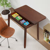 Mid Century folding dining table in cherry finish, showcasing hidden storage for books and magazines, with a sleek.