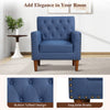 Mid Century Modern accent chair in blue with button tufted design and rivets, perfect for living rooms and home offices.